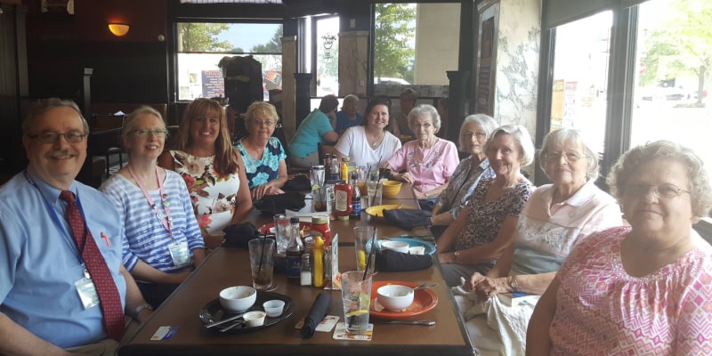 Photograph of Piqua Public Library staff and patrons eating lunch together in a restaurant.