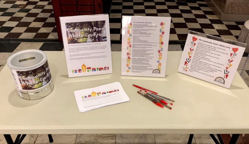 Photograph of Community Poem table in the Piqua Public Library lobby