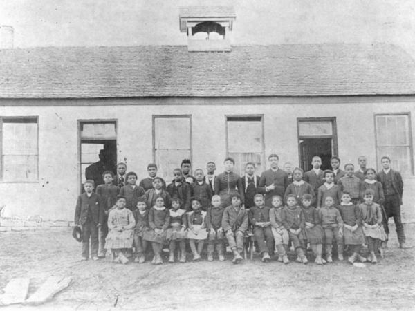 Black and white photograph of the Harveysburg Free Black School with students and teachers.