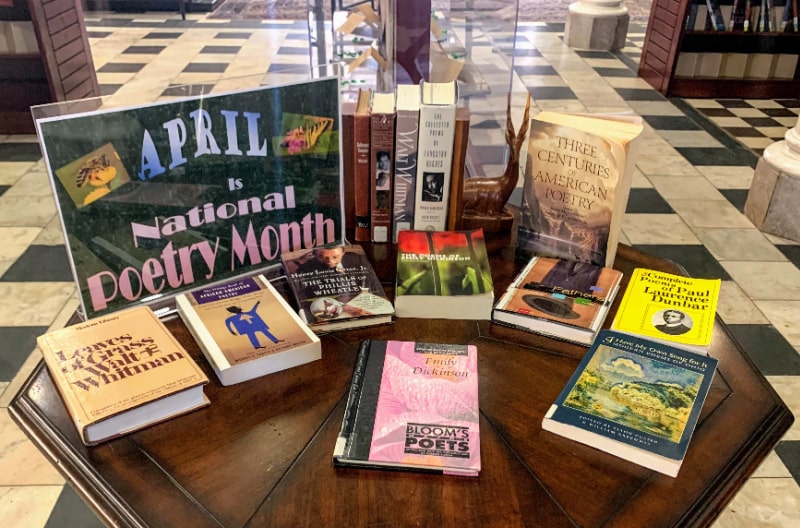 Photograph of table with poetry books on it in the Piqua Public Library lobby
